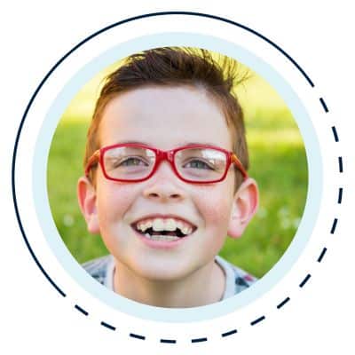Boy in glasses smiling