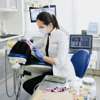 The evolution of dentistry 4 Dentist working on patient's teeth, representing dentistry